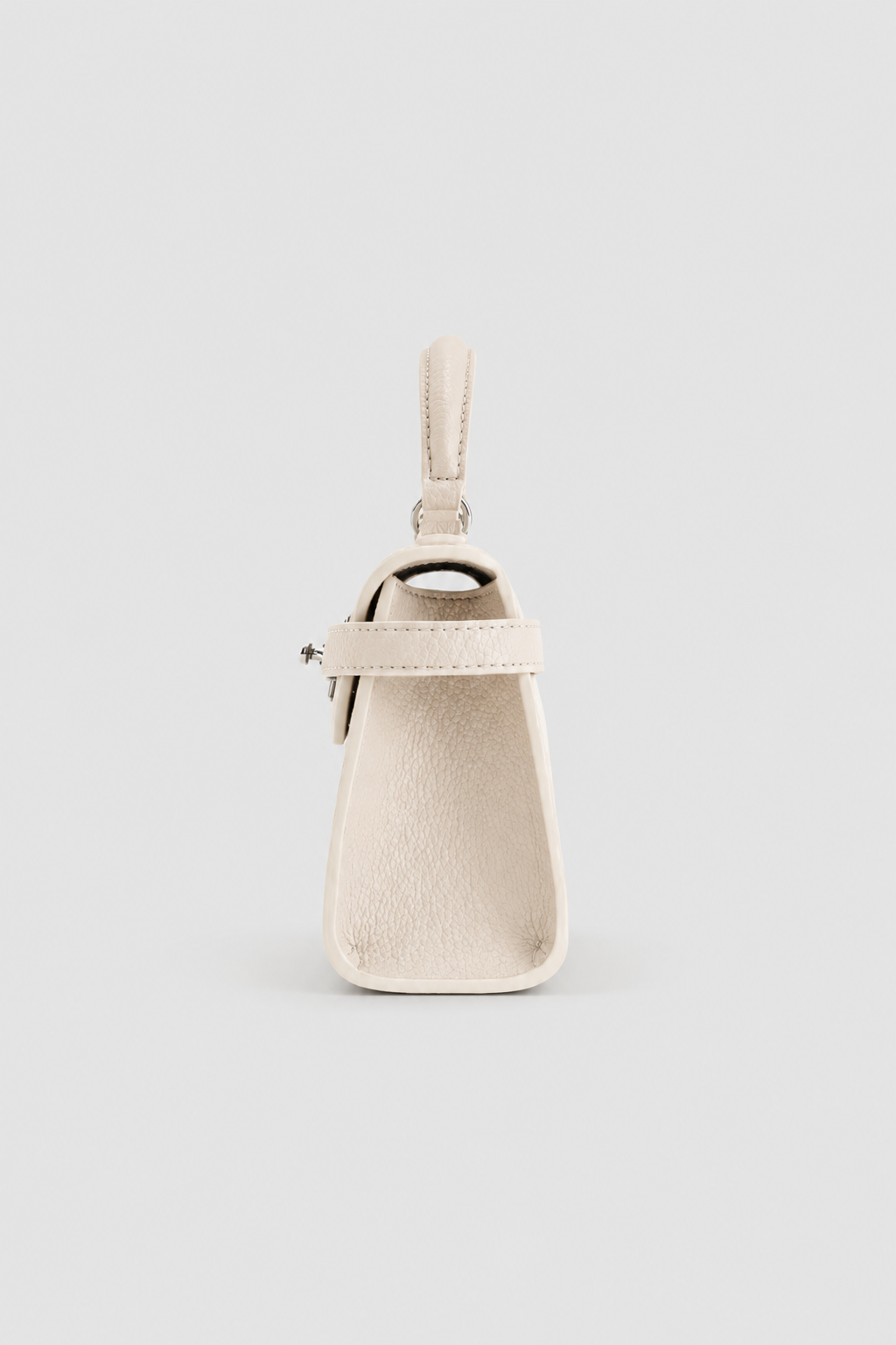 Elegant Trapezoidal Mini Handbag – Structured Silhouette with Textured Finish