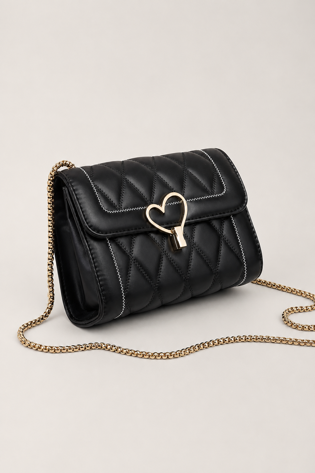 Elegant Heart-Lock Crossbody Bag – Compact Silhouette with Lustrous Strap