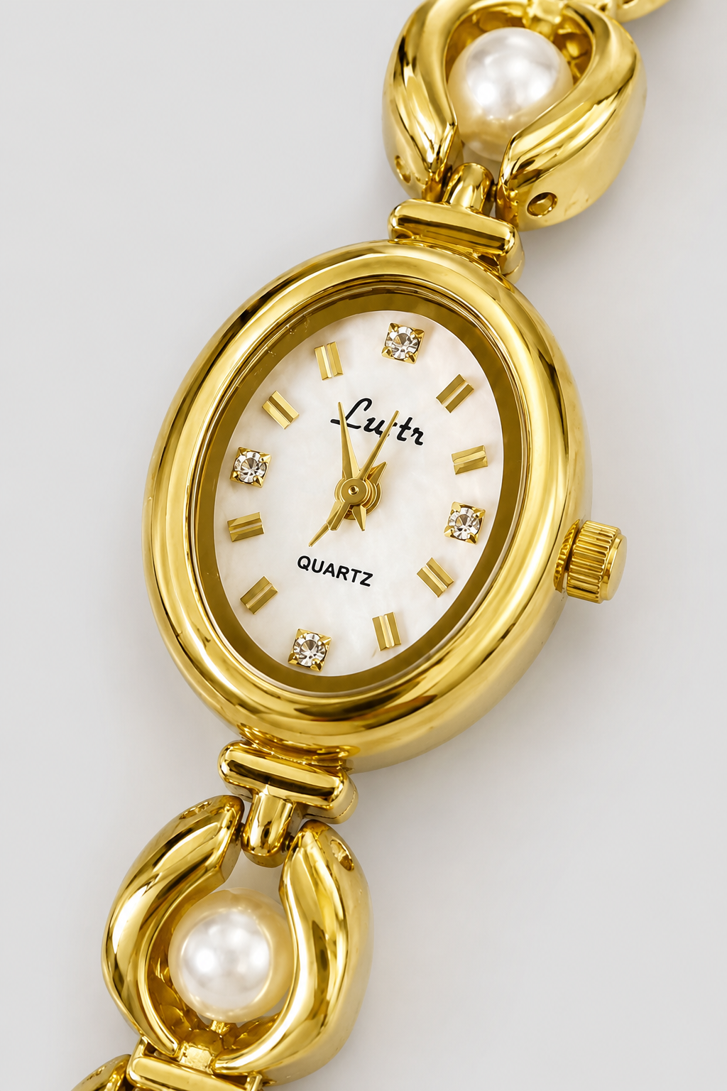 Refined Oval Watch – Polished Links with Lustrous Spherical Accents