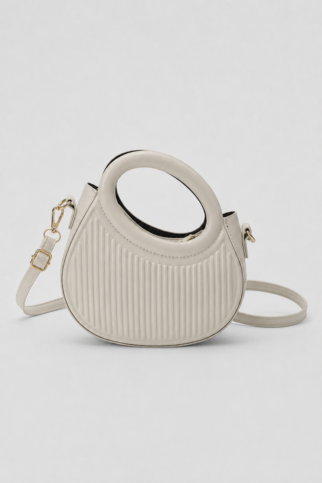 Sculptural Crescent Handbag – Pleated Textured Body with Integrated Circular Handle