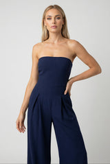 Axelbandslös jumpsuit med vida ben - Modern klass i mörkblått  