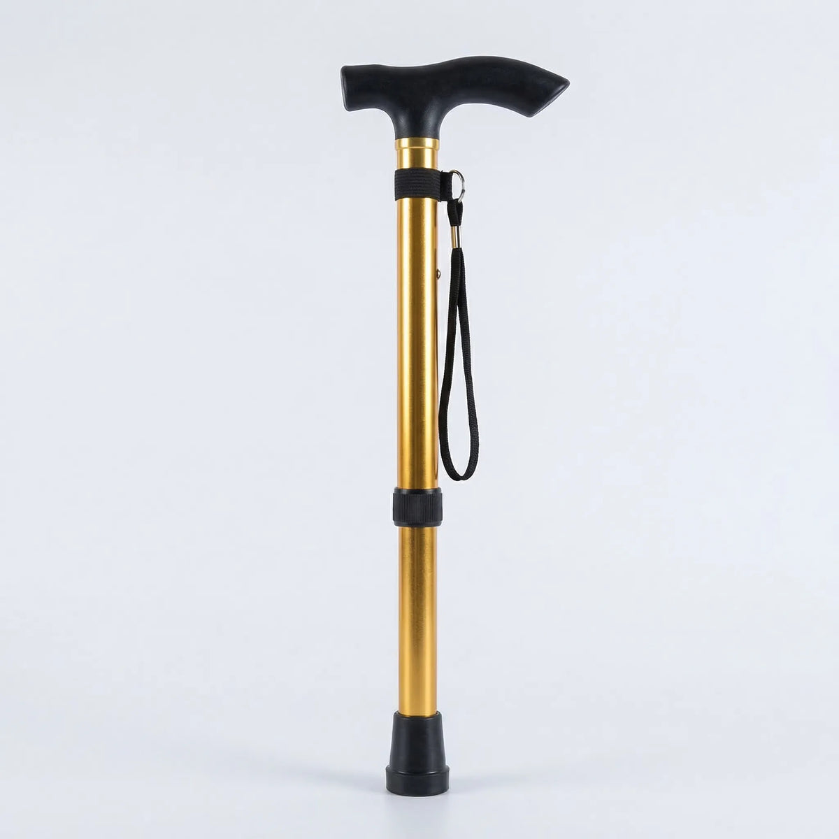 health care : Foldable Aluminum Walking Stick with T-Handle and Wrist Strap in Gold van Vanda Liamo