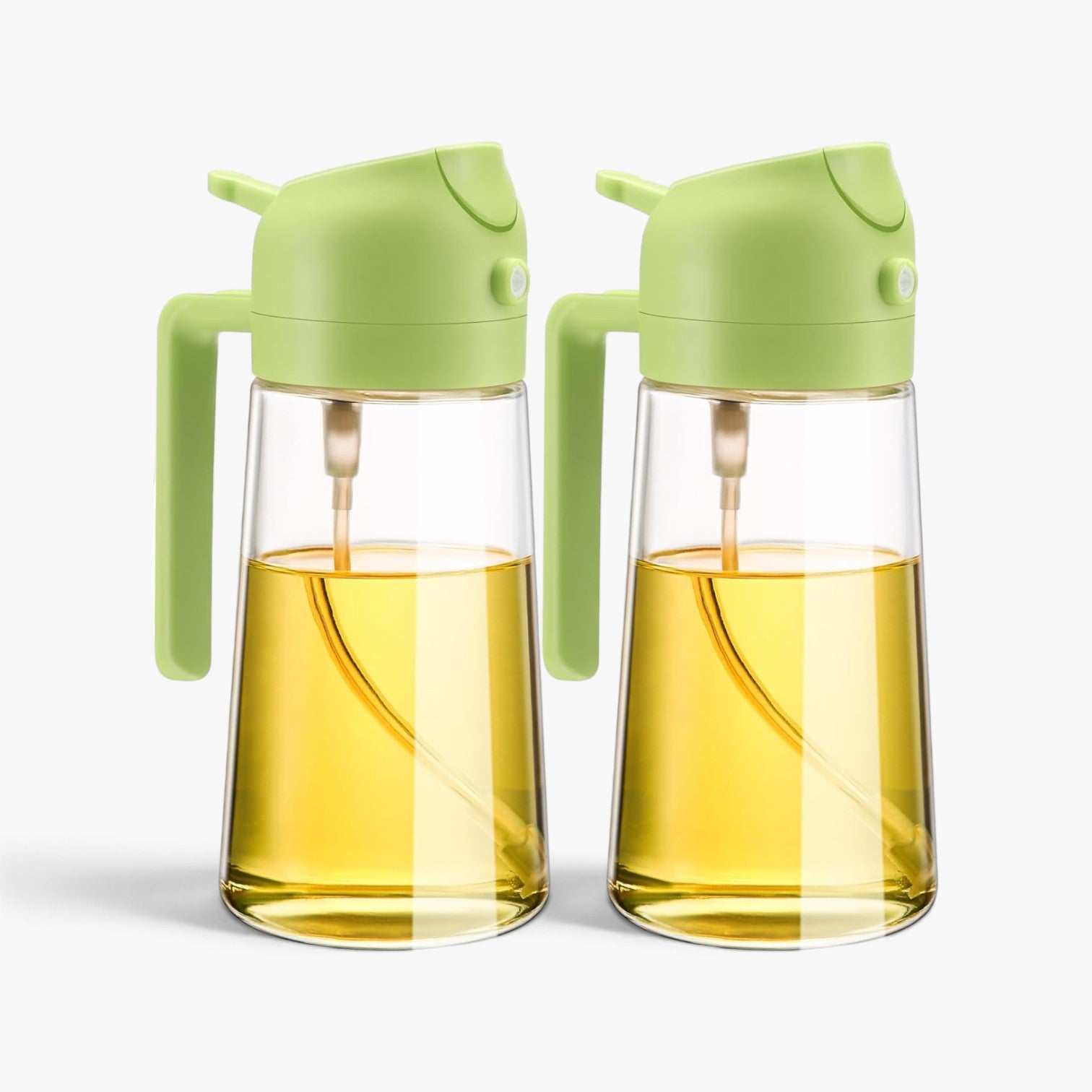 Roselva 2-pack green glass oil dispenser and sprayer bottles with a 2-in-1 pour and mist design for kitchen use.