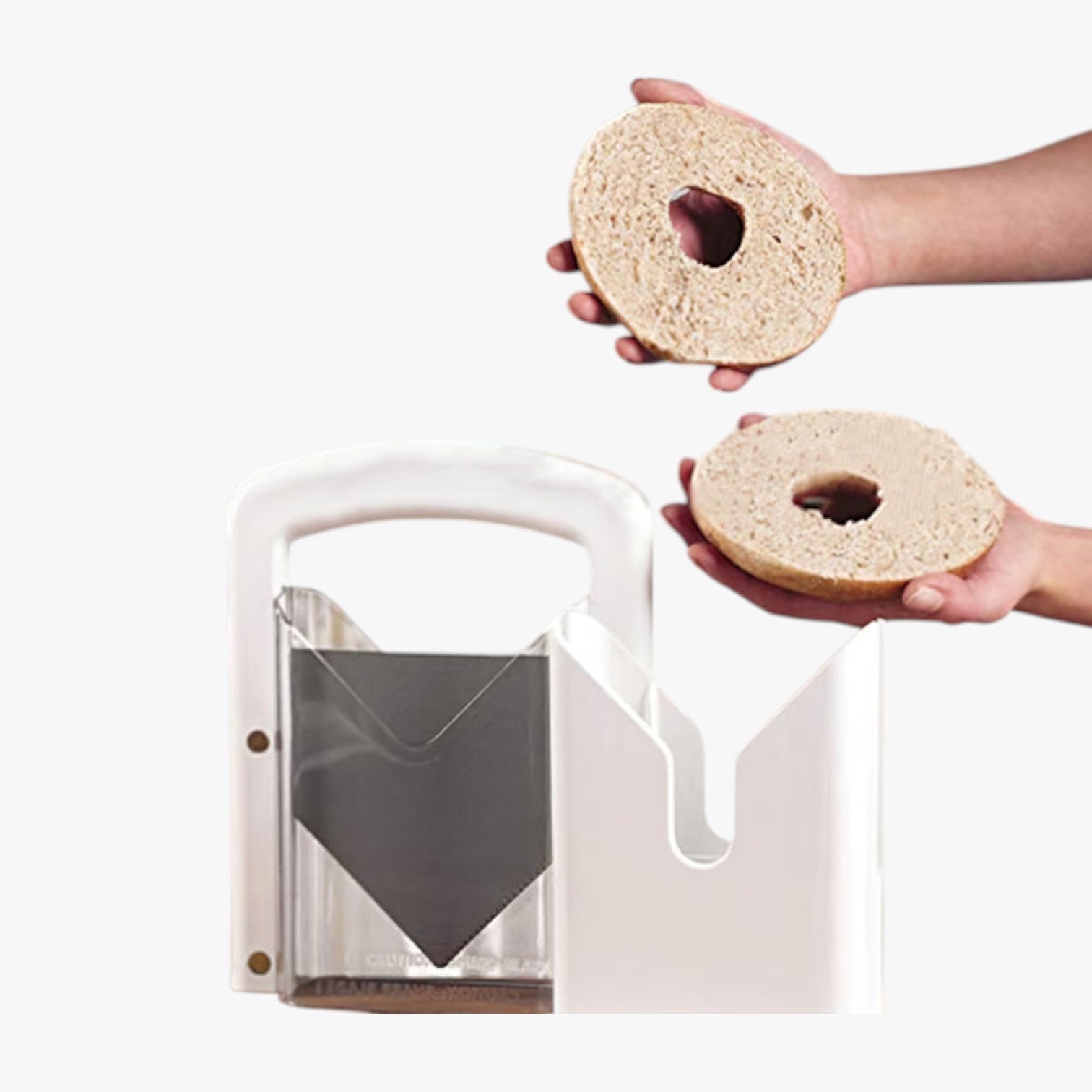 Roselva stainless steel guillotine bagel slicer with a white frame and serrated blade slicing a bagel in half