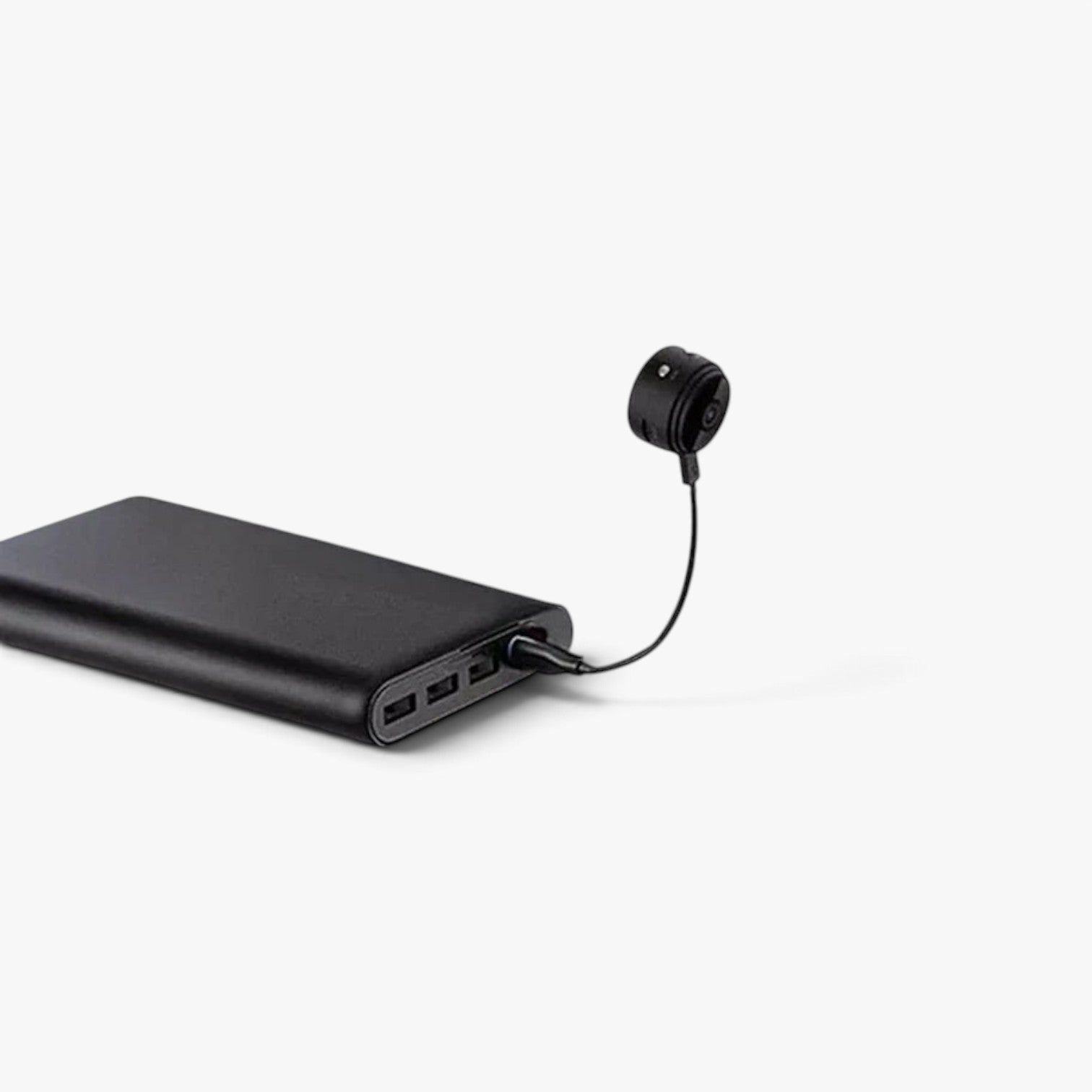 Roselva wireless backup camera connected to a black portable power bank for charging